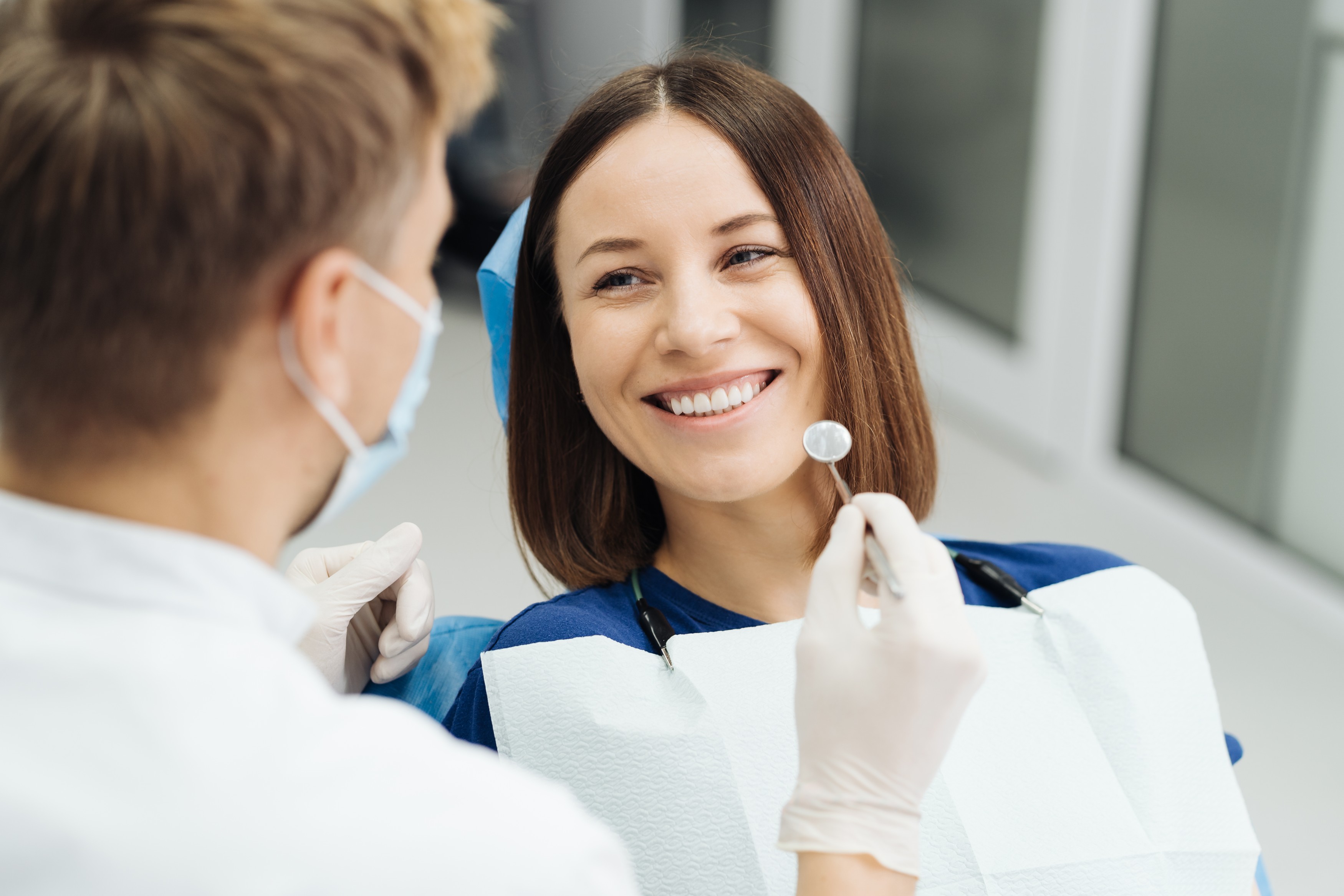Dental hygienist working with a patient